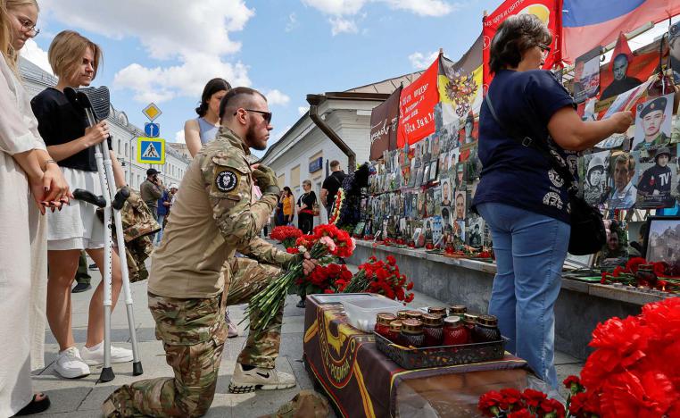 People gather in front of a makeshift memorial, which was erected following head of Russias Wagner mercenary group Yevgeny Prigozhin and group commander Dmitry Utkin's death in 2023