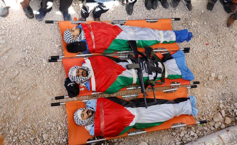Bodies of three Palestinians who were killed in an Israeli raid