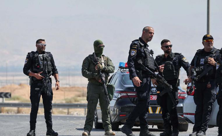 Israeli security forces gather at the scene of a reported attack near the Allenby Crossing