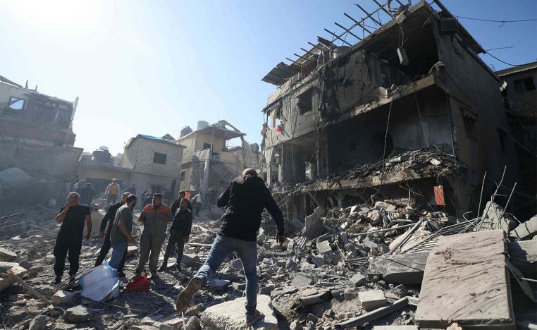 People inspect the debris a day after an Israeli airstrike in Beirut''s southern suburb of Jnah