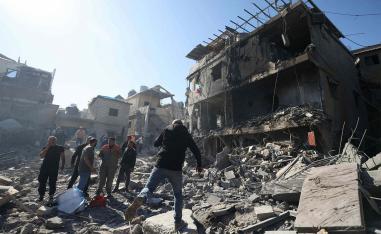 People inspect the debris a day after an Israeli airstrike in Beirut''s southern suburb of Jnah