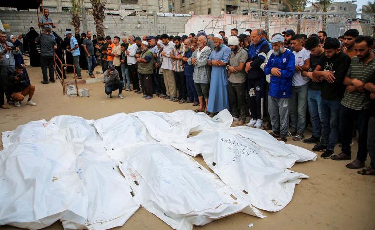 Funeral prayers next to the bodies of Palestinians including members of Abu Taima family, who were killed in an Israeli strike in Khan Younis