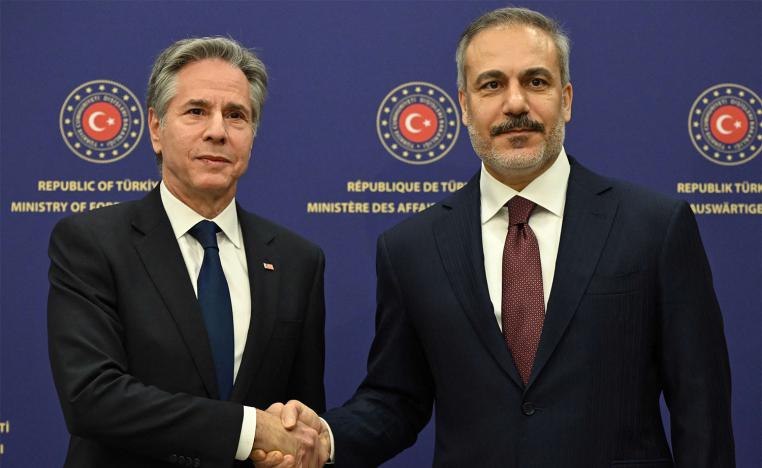Blinken shakes the hand of Fidan