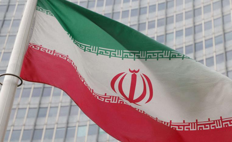 The Iranian flag flutters outside the IAEA headquarters in Vienna