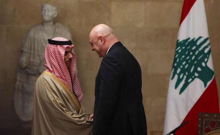 Saudi FM Prince Faisal bin Farhan Al Saud shakes hands with Lebanese President Joseph Aoun at the presidential palace, in Baabda