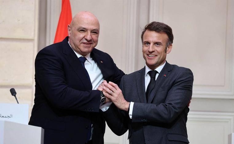 French President Emmanuel Macron and Lebanese President Joseph Aoun shake hands during a joint press conference