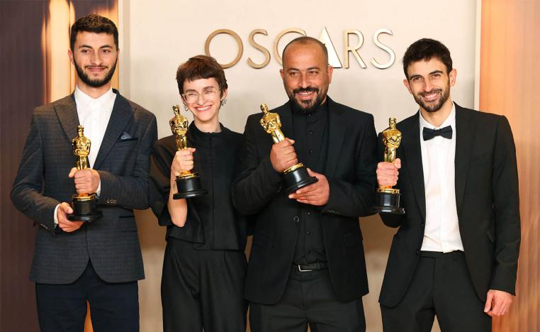 Basel Adra, Rachel Szor, Hamdan Ballal and Yuval Abraham pose with the Oscar for Best Documentary Feature Film for No Other Land 