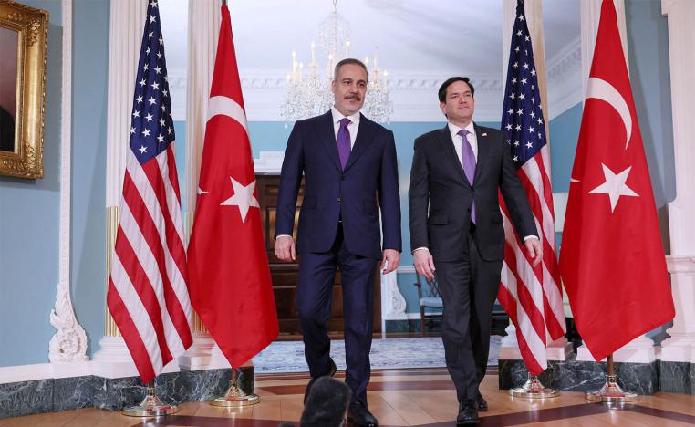 US Secretary of State Marco Rubio walks into the room with Turkish Foreign Minister Hakan Fidan at the State Department in Washington