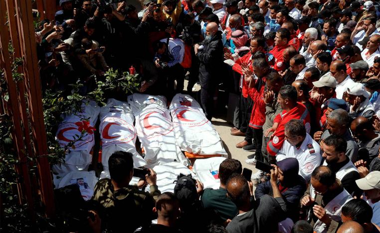 Palestinians mourn medics, who came under Israeli fire while on a rescue mission, after their bodies were recovered