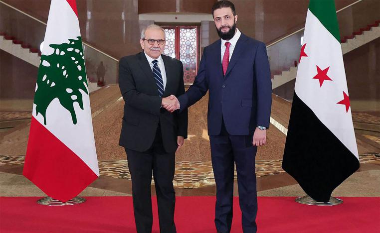 Sharaa shaking hands with Salam