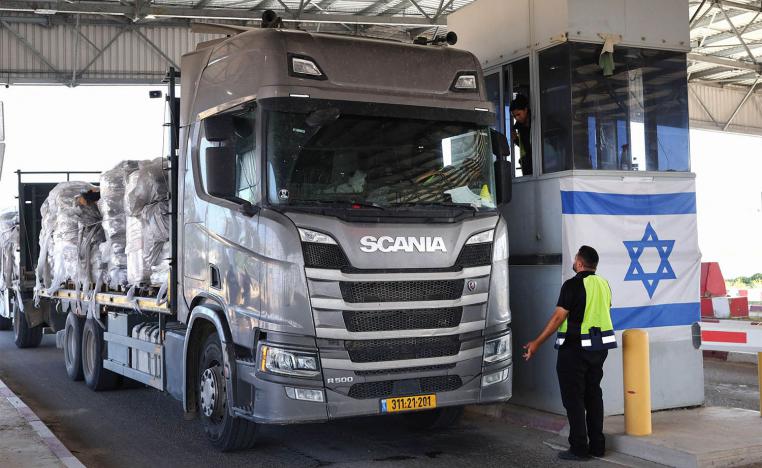 A trucks carrying humanitarian aid drives through the Kerem Shalom crossing 