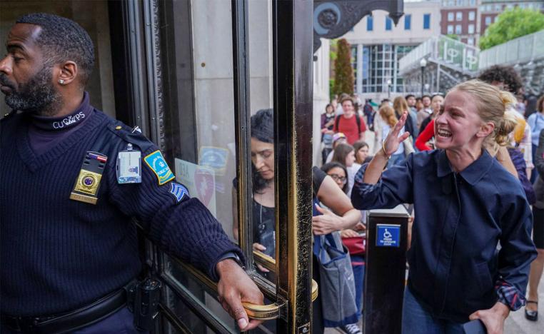 A pro-Palestinian protester yells to let students out of the Butler Library on the campus of Columbia University in New York