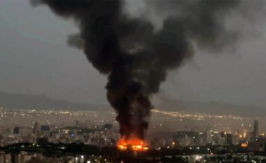 Smoke rises from a fire in Tehran as the Israel-Iran air war continues