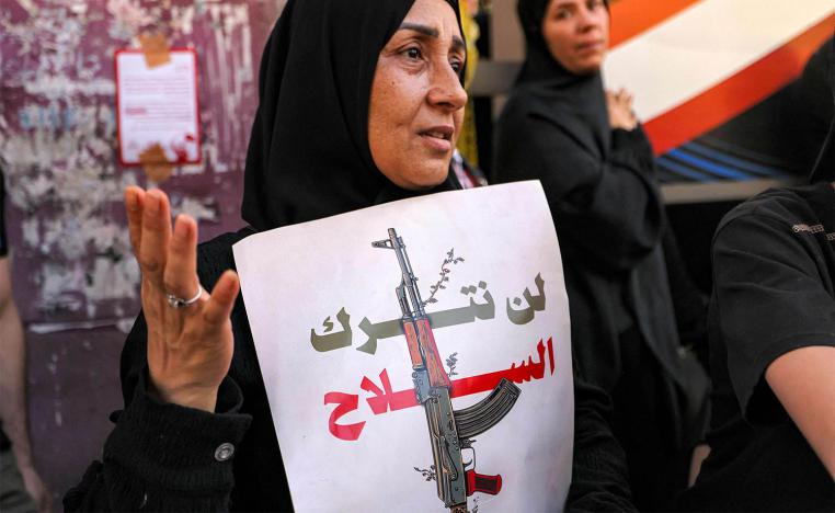 We will relinquish arms, reads the banner