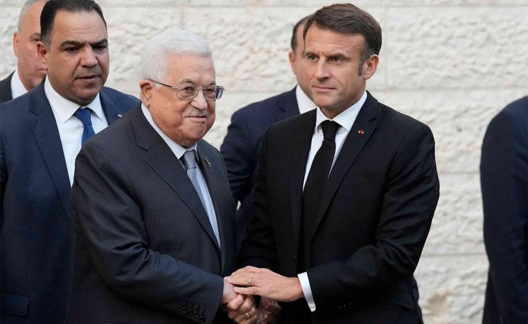 Macron shaking hands with Abbas