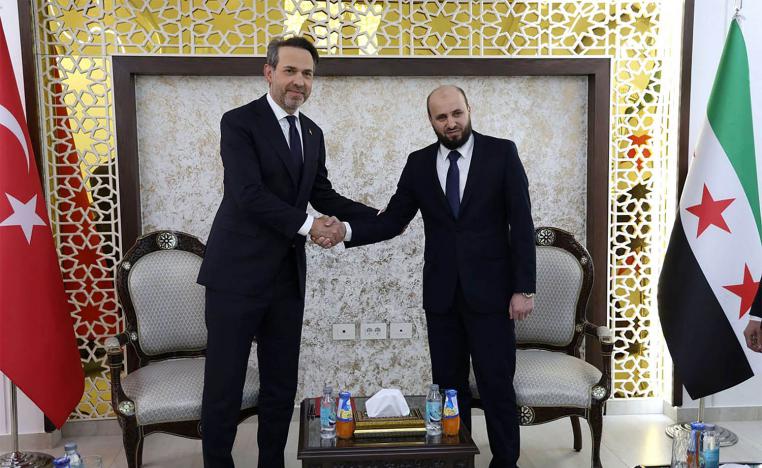 Syria's Minister of Energy Mohammed al-Bashir (R) receiving Turkish Minister of Energy Alparslan Bayraktar in Damascus on May 22