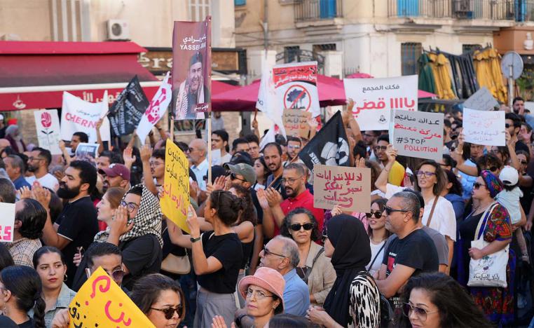 Tunisians march through Tunis to protest a severe environmental crisis caused by pollution from a state chemical plant in Gabes
