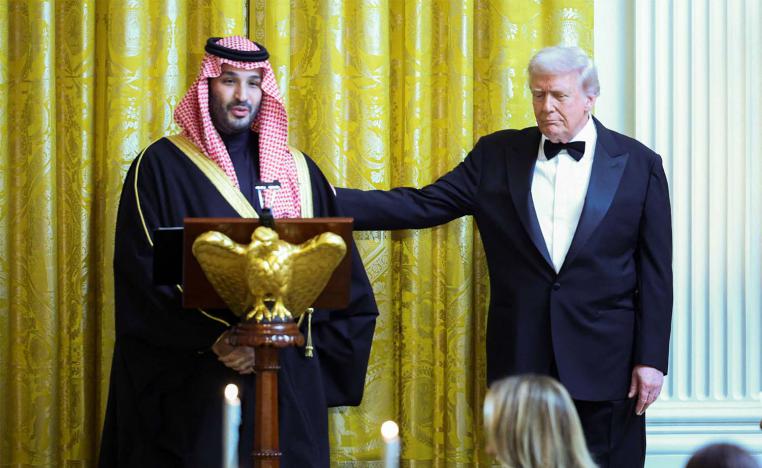 US President Donald Trump greets Saudi Crown Prince Mohammed bin Salman, during a dinner at the White House