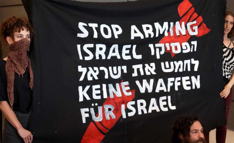 German and Israeli activists block the entrance to the German embassy in Tel Aviv during a protest calling on Germany to stop arming Israel last year