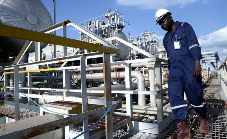 A worker walks by an oil well at the Toma South oil field to Heglig, in Ruweng State, South Sudan.