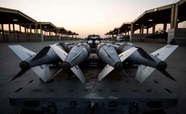 US Airmen prepare to load GBU-31 munition systems onto F-15E Strike Eagles in support of Operation Hawkeye Strike as the US military launched large-scale strikes against dozens of Islamic State targets in Syria, December 19, 2025.