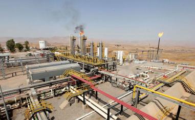 A flame rises from a chimney at Taq Taq oil field in Erbil, in Iraq’s Kurdistan region. 