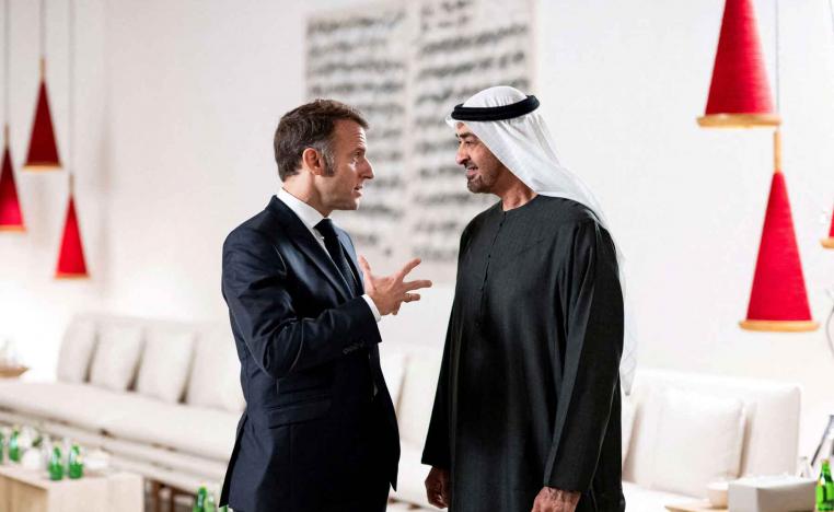 Emirati President Sheikh Mohamed bin Zayed Al Nahyan speaks with French President Emmanuel Macron after a lunch meeting at the Zayed National Museum , Saadiyat Island, Abu Dhabi, December 21, 2025. 