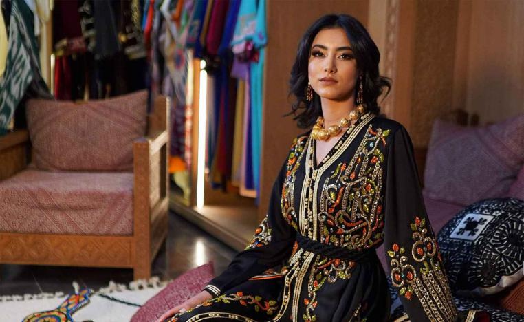 A model wearing the Moroccan caftan poses for a picture. 