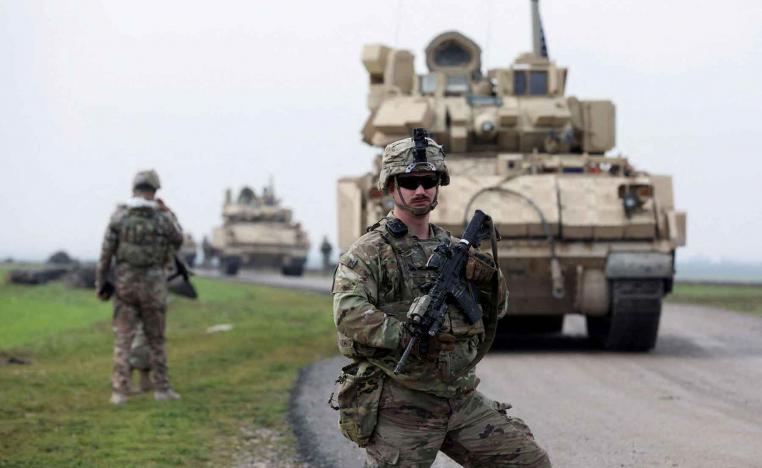 A soldier from the US-led coalition stands guard in the countryside of Qamishli in northeastern Syria, February 8, 2024. 
