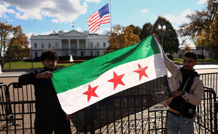 Dr. Suzan Amedi  A Syrian flag is displayed outside the White House following the meeting of US President Donald Trump and Syrian President Ahmed al-Sharaa in the Oval Office of the White House in Washington, November 10, 2025. 