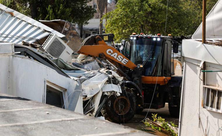 Bulldozers razed several large buildings and other smaller structures inside UNRAW’s compound