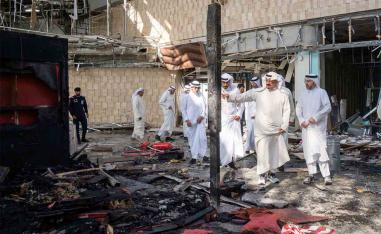 Kuwaiti officials inspect damage inside a terminal at Kuwait International Airport following an Iranian drone and missile attack