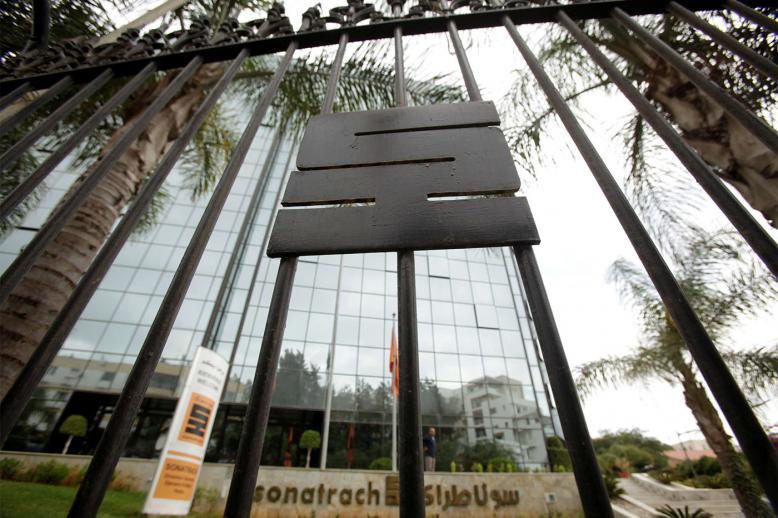 The logo of the state energy company Sonatrach is pictured on a gate outside the headquarters in Algiers