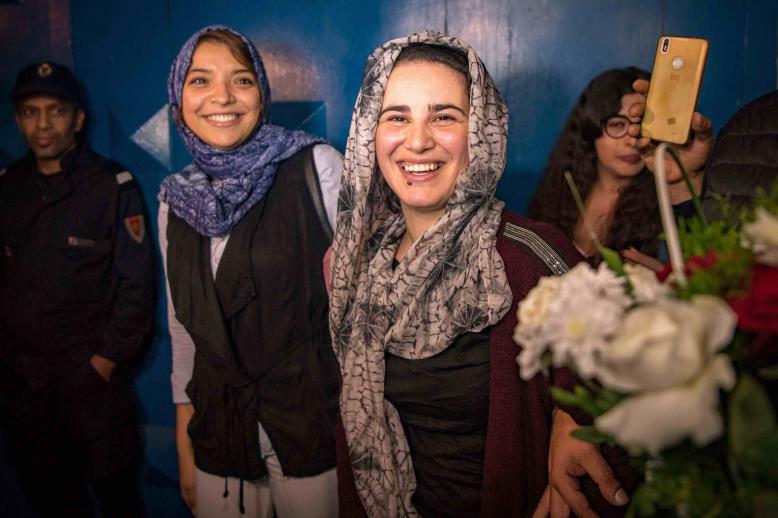 Moroccan journalist Hajar Raissouni (R) is greeted after leaving a prison in Sale near Rabat