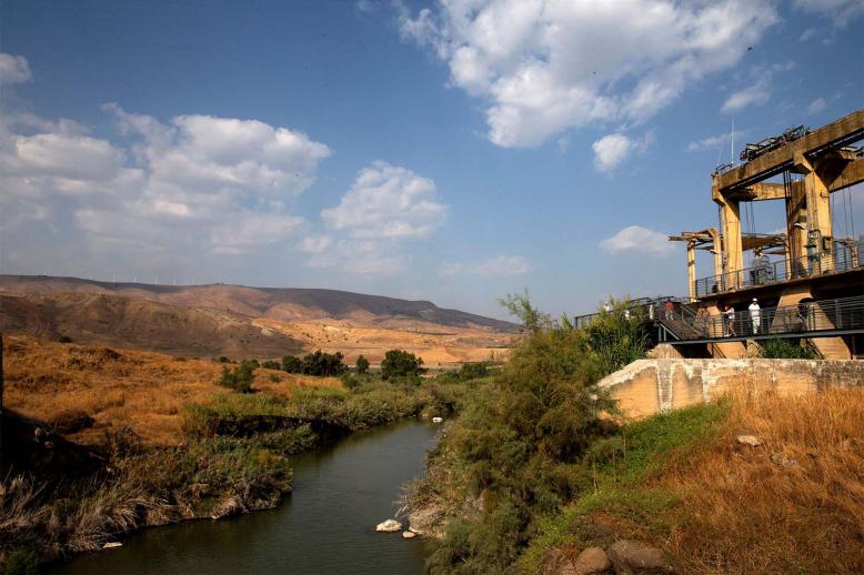 A general view show visitors at an abandoned hydroelectric power plant in the border area between Israel and Jordan near Naharayim 