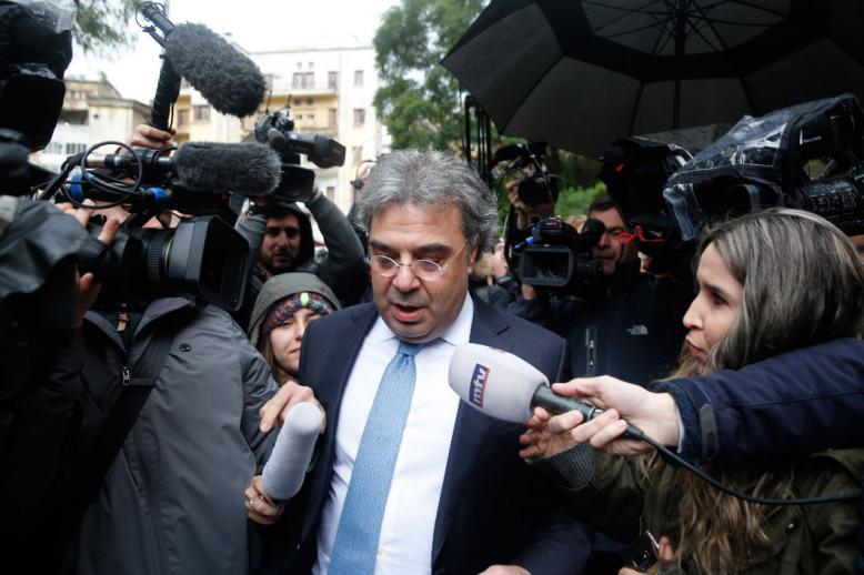 Carlos Abou Jaoude, center, a lawyer for ex-Nissan chief Carlos Ghosn, speaks to journalist as he leaves the judicial palace in Beirut