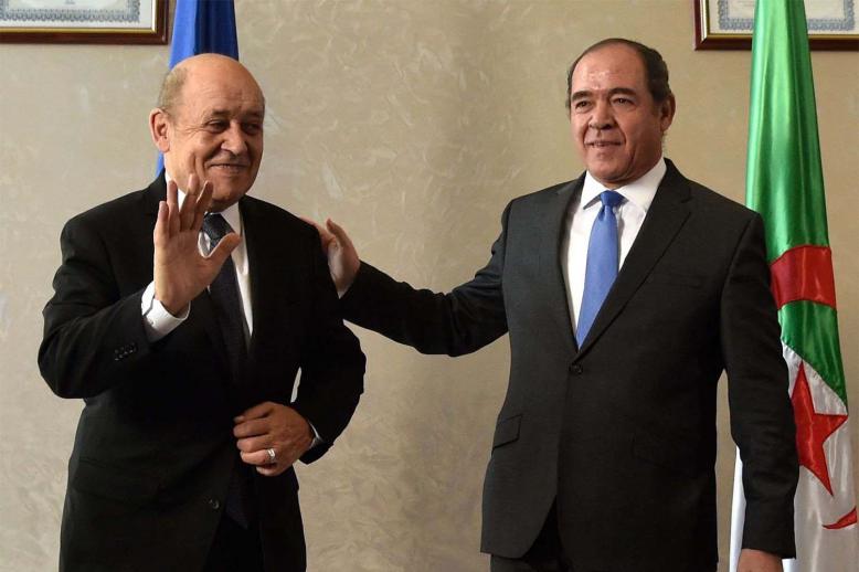 French Foreign Minister Jean-Yves Le Drian (L) and Algerian Foreign Minister Sabri Boukadoum