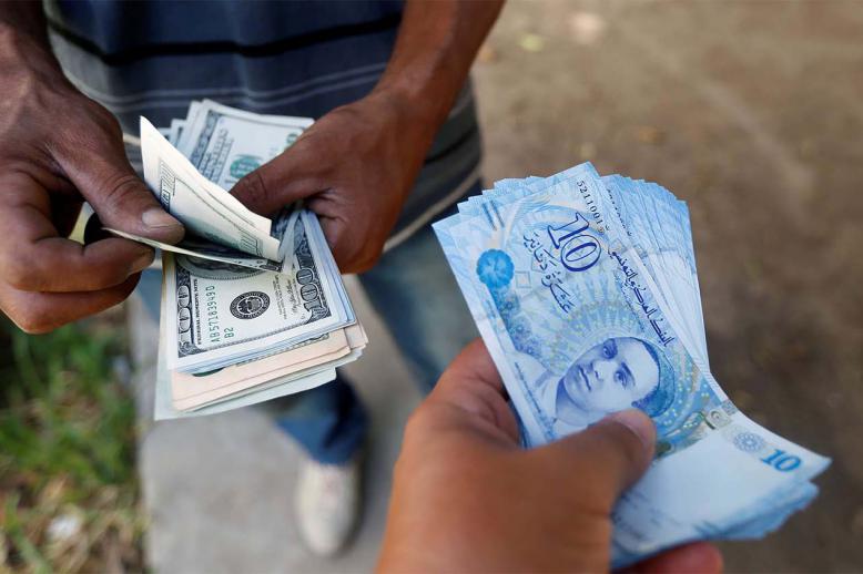 The law will reduce taxes for real estate investors and allow companies to settle foreign exchange violations by paying the fees due plus interest of 10%