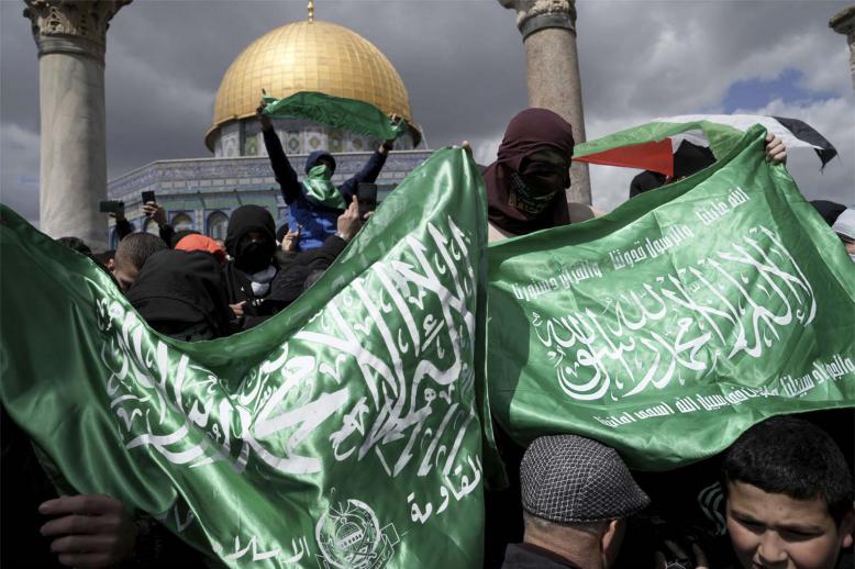 Palestinians display Hamas militant flags
