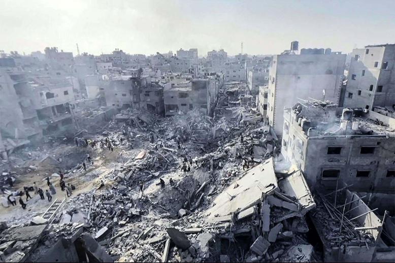 Palestinians checking the destruction in the aftermath of an Israeli strike on the Jabalia refugee camp in the Gaza Strip