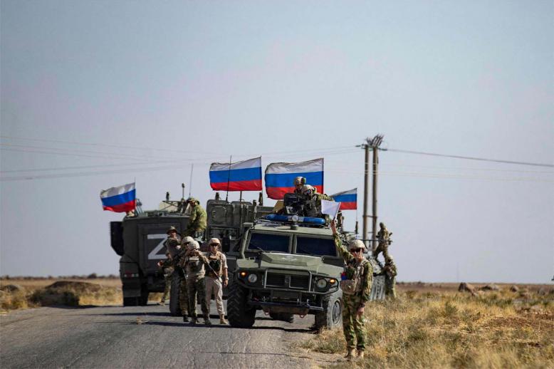 Soldiers of a Russian military convoy in in the northeastern Hasakah province