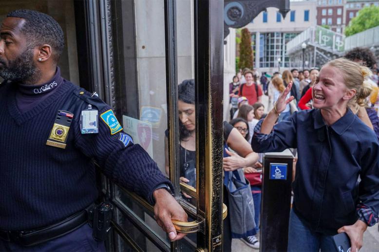 A pro-Palestinian protester yells to let students out of the Butler Library on the campus of Columbia University in New York