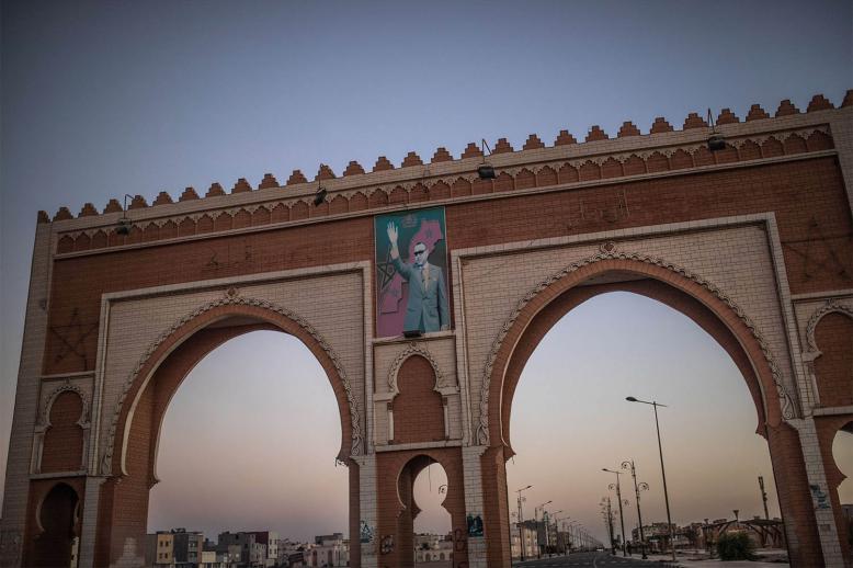 An archway in the entrance of Dakhla carries an image of Morocco's King Mohammed VI