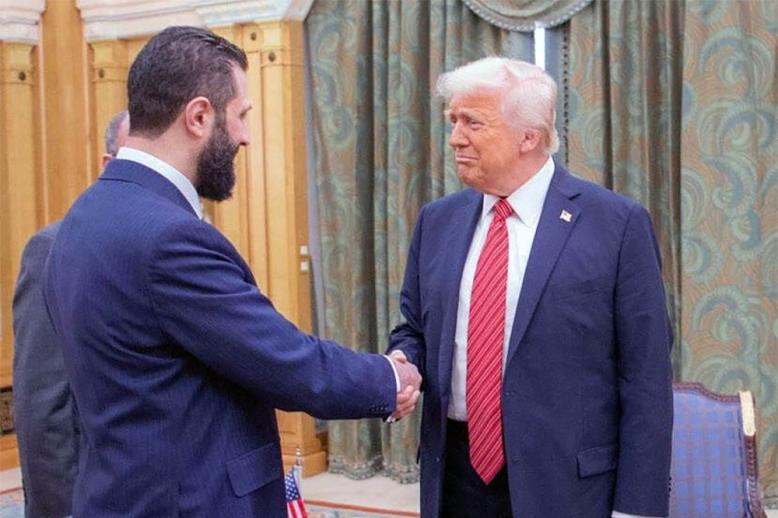 Trump shaking hands with Sharaa