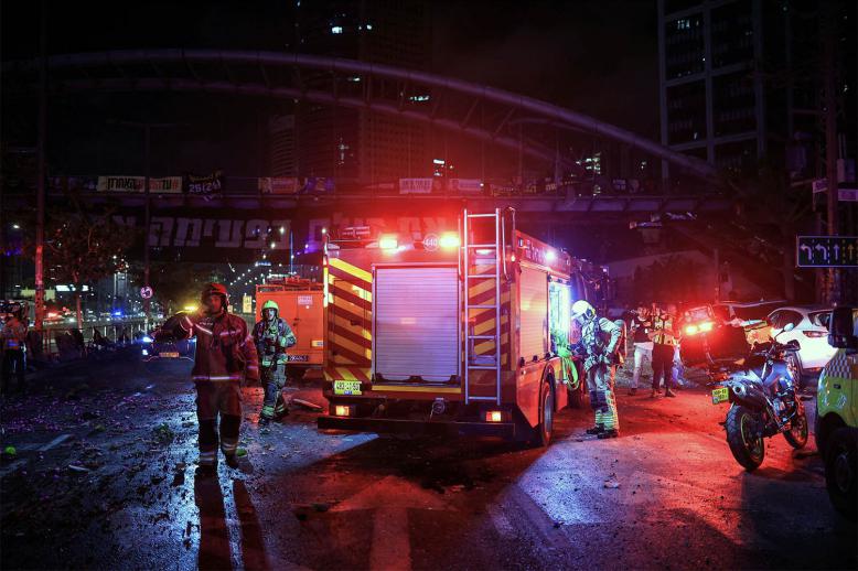 First responders work at an impact site following missile attack from Iran on Israel, in Tel Aviv