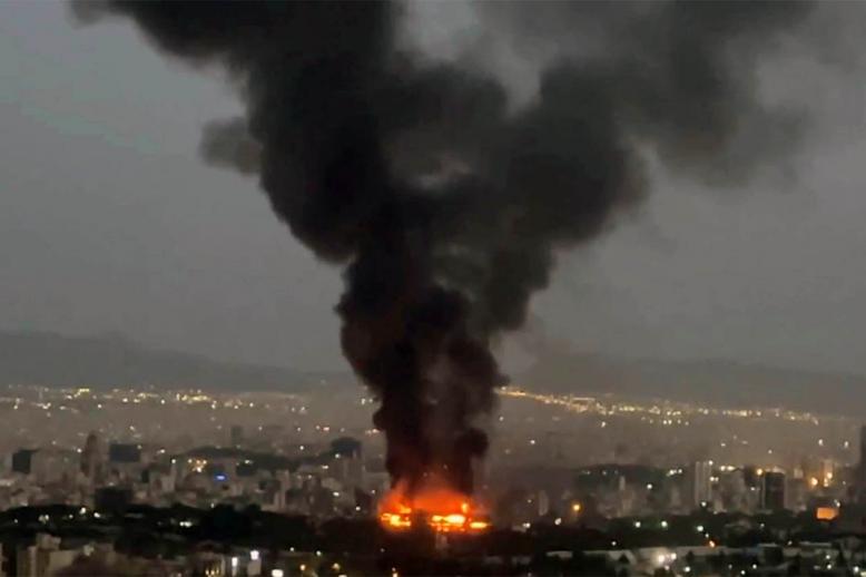 Smoke rises from a fire in Tehran as the Israel-Iran air war continues