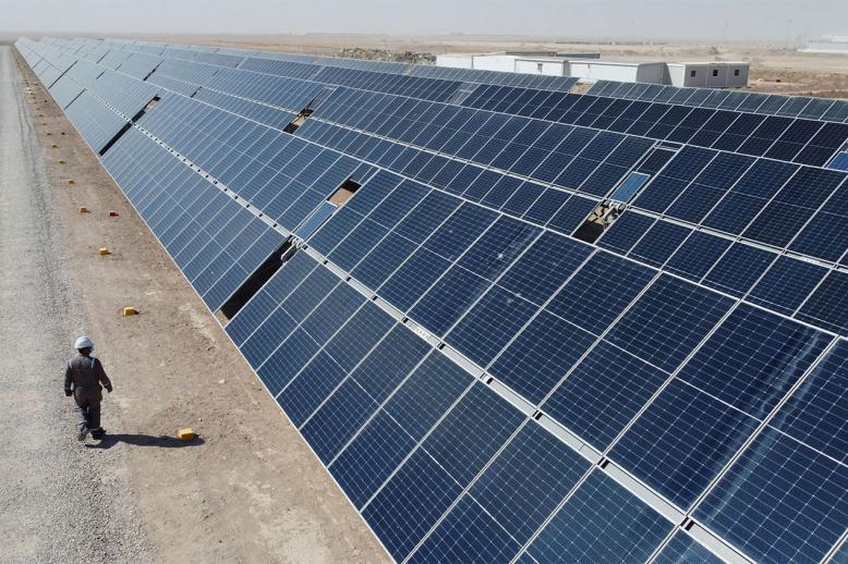 A general view shows solar panels at the Faihaa oil field in Basra