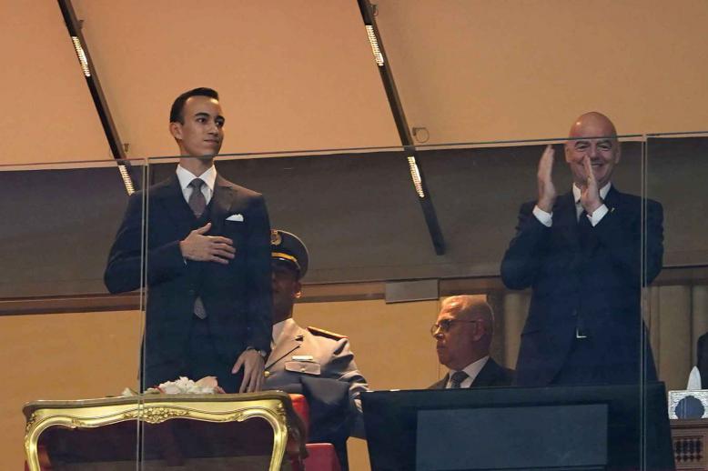 Morocco’s Crown Prince Moulay El Hassan and FIFA President Gianni Infantino in the stands at Prince Moulay Abdellah Stadium in Rabat, December 21, 2025.