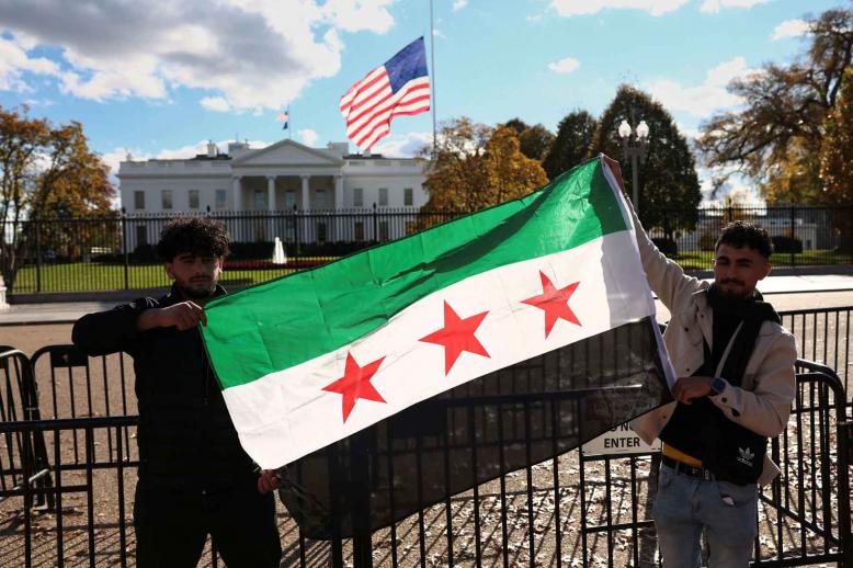 Dr. Suzan Amedi  A Syrian flag is displayed outside the White House following the meeting of US President Donald Trump and Syrian President Ahmed al-Sharaa in the Oval Office of the White House in Washington, November 10, 2025. 