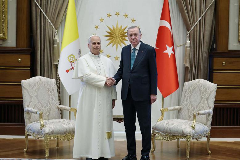 Pope Leo XIV shakes hands with Turkish President Tayyip Erdogan as they meet at the Presidential Palace in Ankara